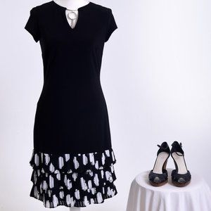 Fanciful, fun Black Dress with a layered ruffle edge for fun! Size 6